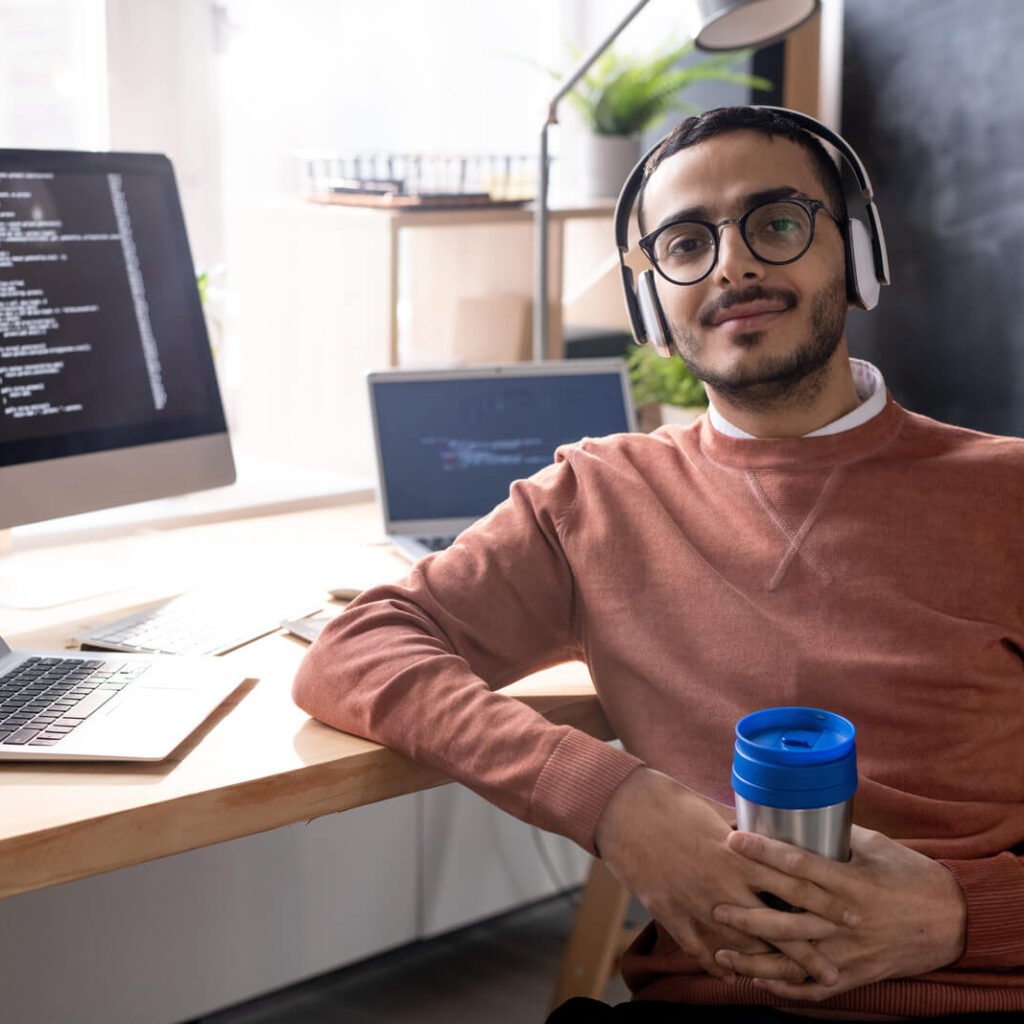 E-commerce web development: building online stores that sell. handsome programmer in headphones listening to mus 2023 11 27 04 56 48 utc